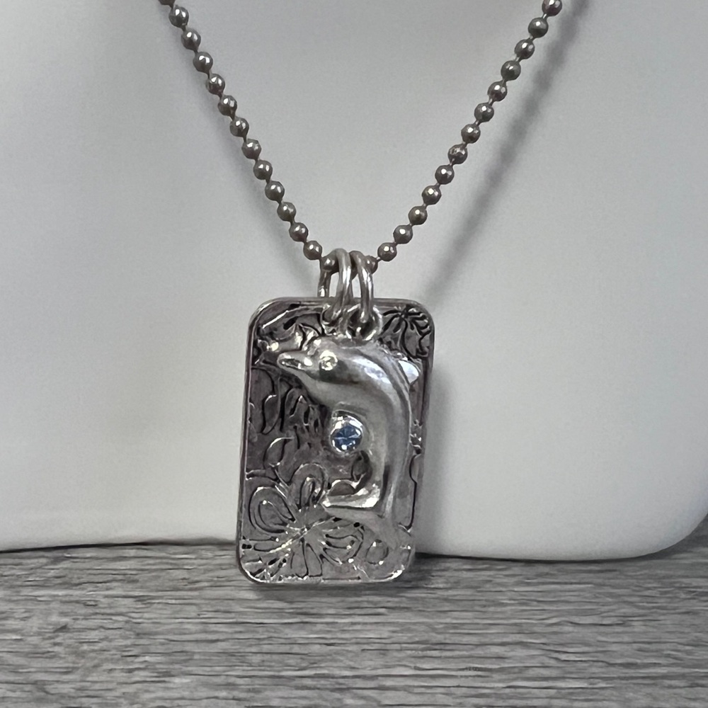 Vintage Silver toned metal dolphin tag Necklace with aquamarine crystal